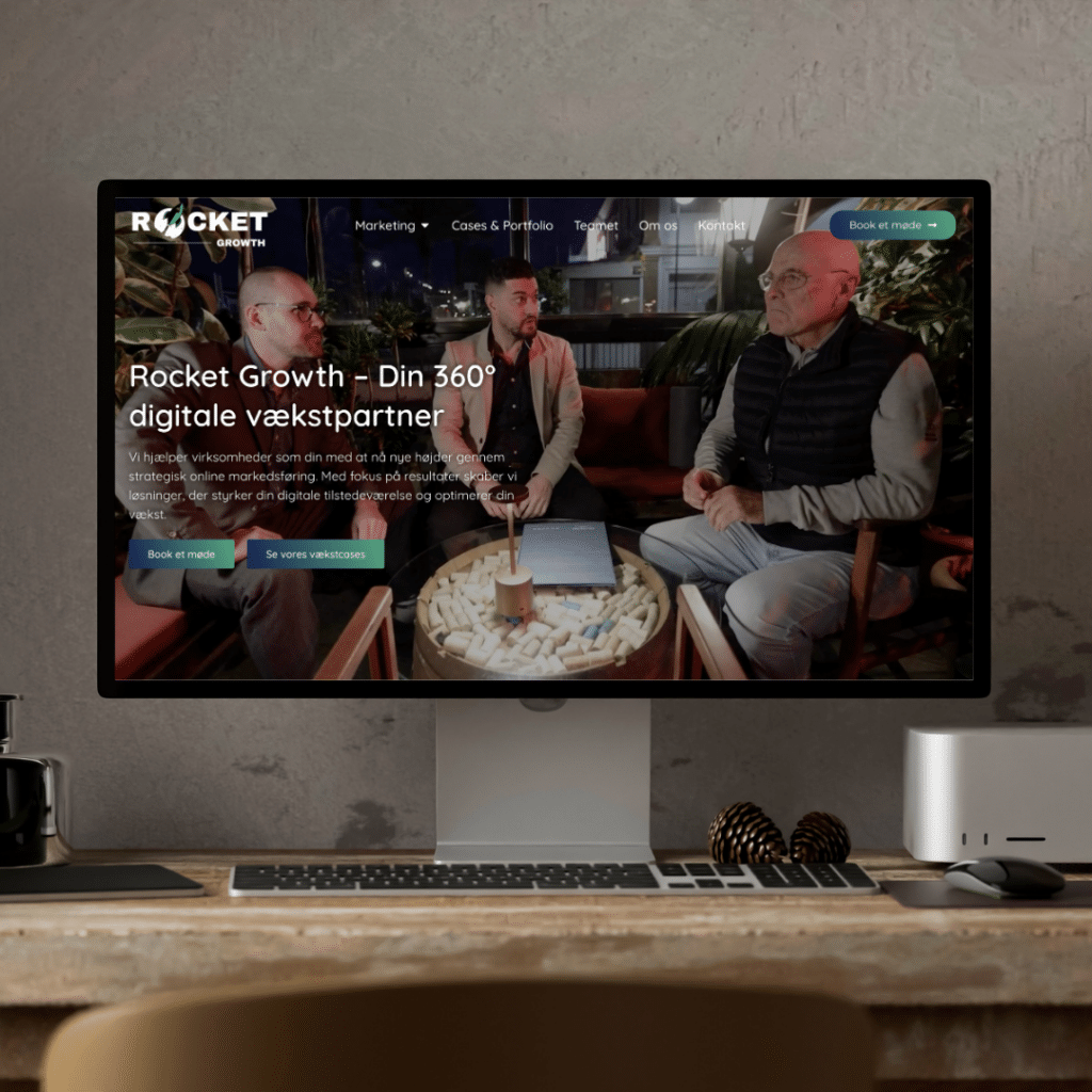 Computer screen displaying the Rocket Growth website with three people sitting at a table.